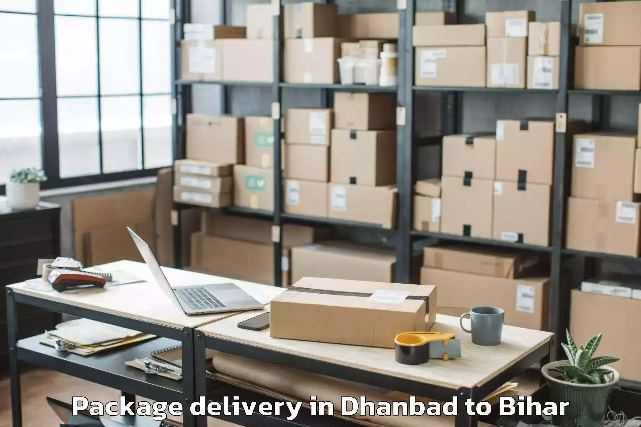 Easy Dhanbad to Wazirganj Package Delivery Booking